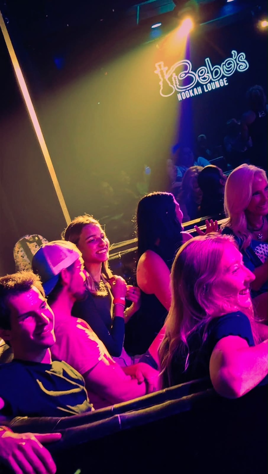 Audience enjoying a Hardbodies Live performance at a nightlife venue